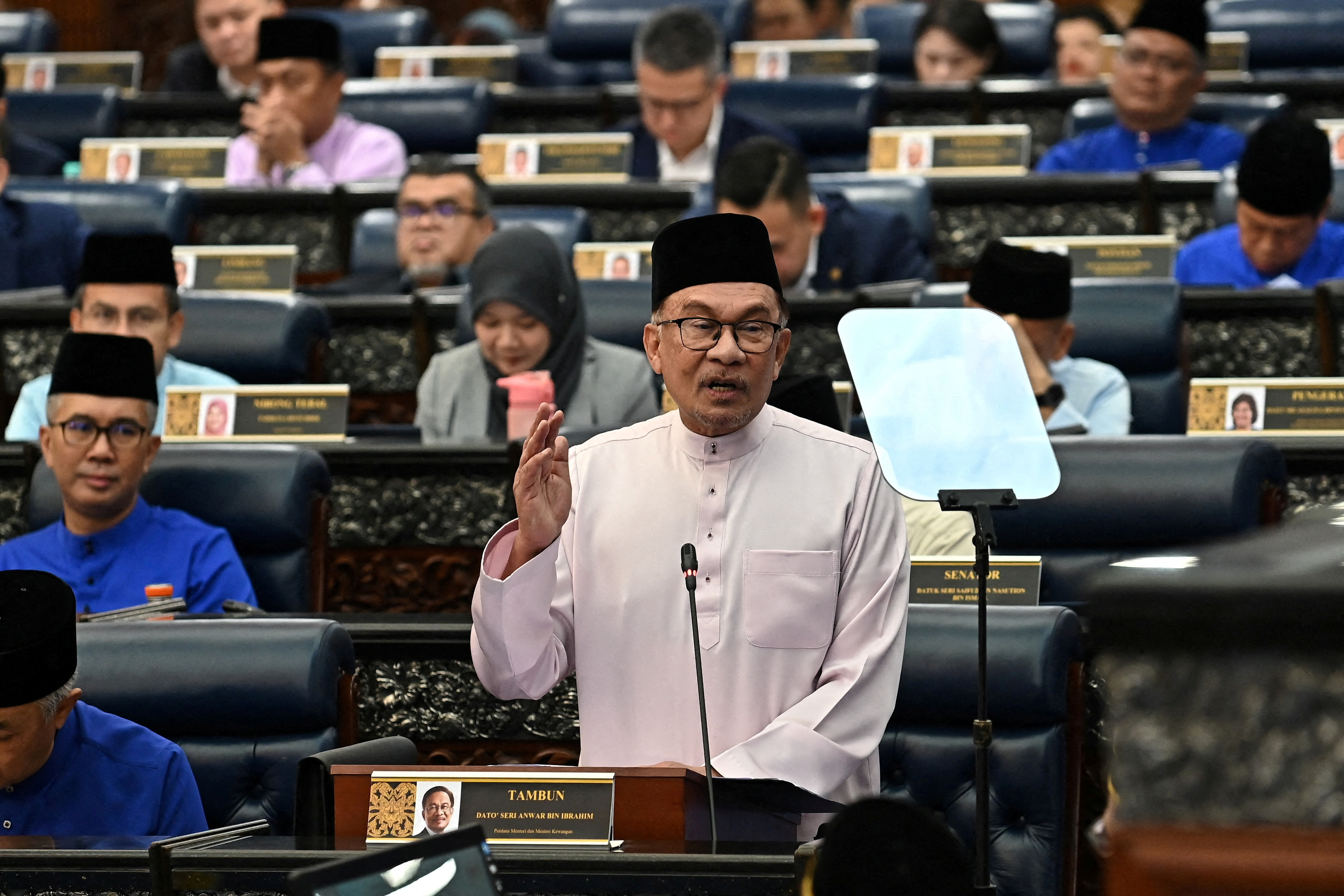 Malaysia's Prime Minister and Finance Minister Anwar Ibrahim tables the 2024 Malaysia's budget at Kuala Lumpur