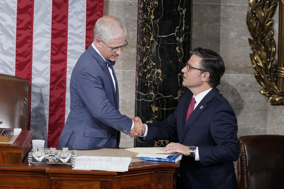 FILE - Temporary House speaker Rep. Patrick McHenry, R-N.C., talks with Rep. Mike Johnson, R-La., before Republicans try to elect Johnson to be the new House speaker, at the Capitol in Washington, Oct. 25, 2023. McHenry, who presided temporarily over the U.S. House for three intense weeks while Republicans struggled to elect a permanent speaker after Kevin McCarthy's ouster, announced on Tuesday, Dec. 5, that he won't seek reelection to his seat next year. (AP Photo/Alex Brandon, File)