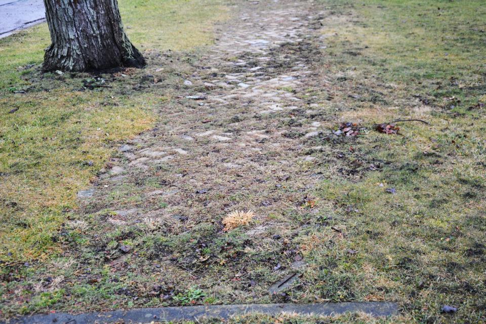 The sidewalks along Walker Street in Garrett show much wear and tear.