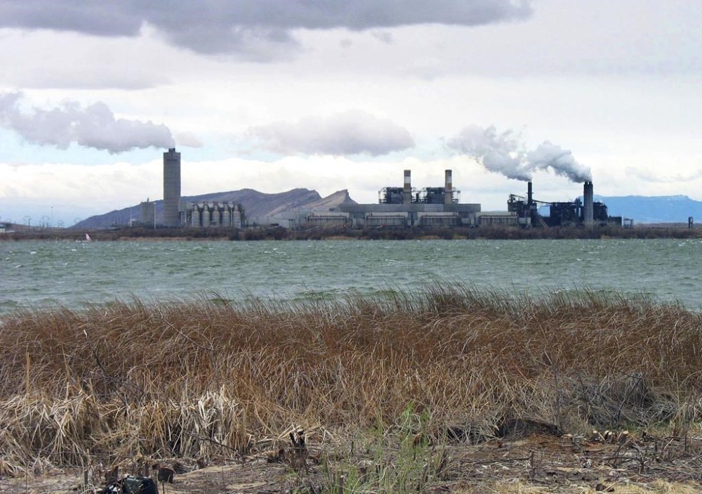 FILE - The Four Corners Power Plant in Waterflow, N.M., near the San Juan River in northwestern New Mexico, is viewed in April 2006. Regulators have rejected an effort by New Mexico's largest electric utility to recoup from customers millions of dollars of investments made in a coal-fired power plant in the northwestern corner of the state, Wednesday, Jan. 3, 2024. (AP Photo/Susan Montoya Bryan, File)