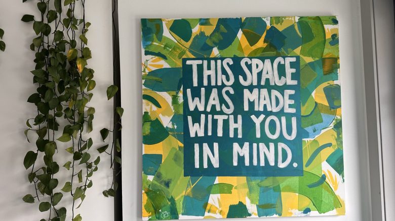 A colorful sign at a rape crisis center that reads "this space was made with you in mind"