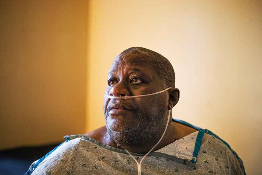 Gary Jones sits for a portrait inside of his  Pleasant View Gardens apartment that he has lived at for 13 years on Tuesday, Jan. 23, 2024, in Ferguson. Jones suffers from chronic obstructive pulmonary disease, diabetes, high blood pressure, and heart problems. He said that his health problems have been exacerbated by a dilapidated apartment next door that was once full of stagnant water and black mold. 