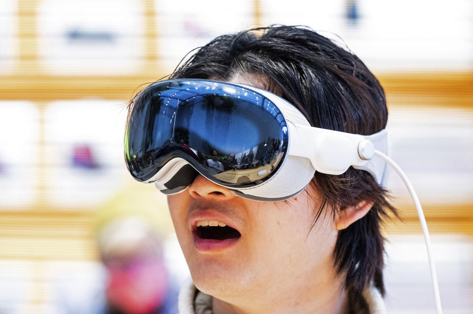 Bryan Chiang tries out an Apple Vision Pro headset during the first day of sales at a Palo Alto, Calif., Apple store on Friday, Feb. 2, 2024. (AP Photo/Noah Berger)