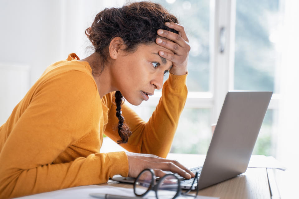 Woman reading news on her computer