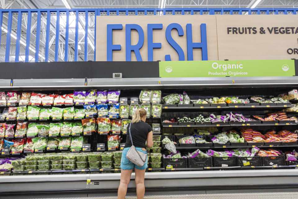 Miami, Hialeah Gardens, Florida, Walmart Supercenter, customer in fresh produce aisle, salad bags vegetables. (Photo by: Jeffrey Greenberg/Universal Images Group via Getty Images)