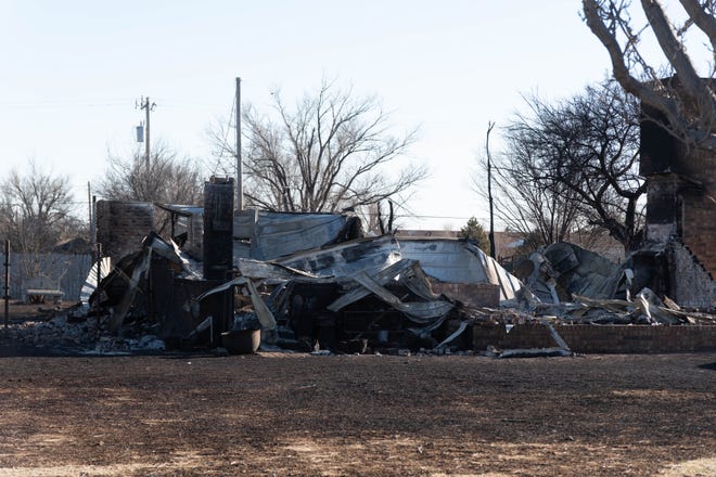 A house destroyed by the Smokehouse Creek wildfire in the Scott Acres area of Stinnett Texas.