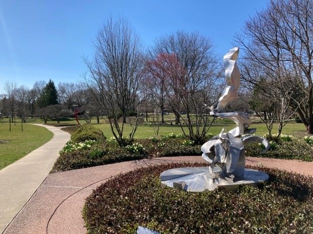 The sculpture "Uplifted" by Richard Hunt occupies a prominent spot along the sculpture trail at Leavitt Park in Flossmoor. It was acquired for the Flossmoor collection in 2003. (Paul Eisenberg/Daily Southtown)