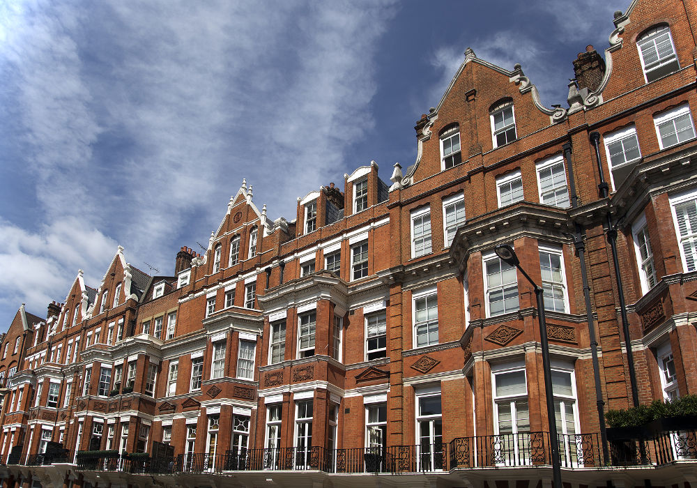 Row of red brick apartments in Mayfair, London, UK