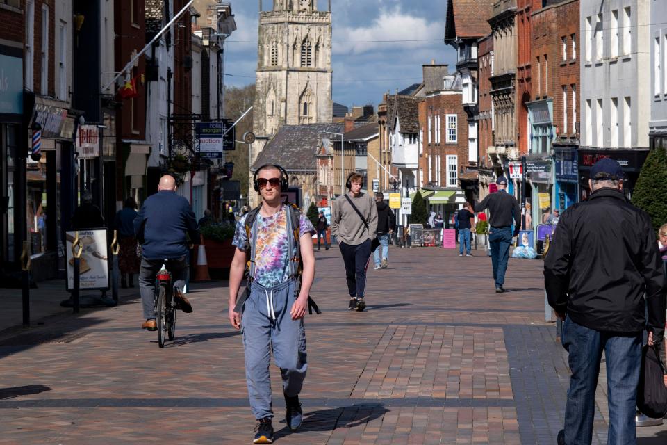 People and shoppers out and about. The FTSE was in the green on Friday