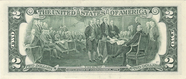 Image of the back of a two dollar bill featuring John's Trumbull's Declaration of Independence