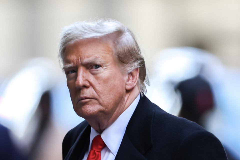 Former US President Donald Trump arrives at 40 Wall Street after his court hearing to determine the date of his trial for allegedly covering up hush money payments linked to extramarital affairs in New York City on March 25, 2024. Trump faces twin legal crises today in New York, where he could see the possible seizure of his storied properties over a massive fine as he separately fights to delay a criminal trial even further. (Photo by Charly TRIBALLEAU / AFP) (Photo by CHARLY TRIBALLEAU/AFP via Getty Images)