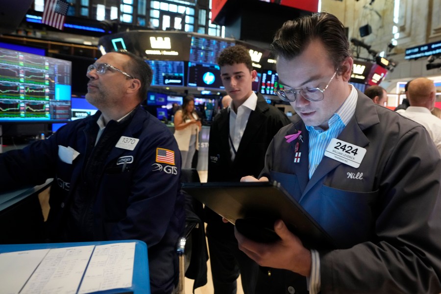 FILE - Trader William Lovesick, right works on the floor of the New York Stock Exchange, June 12, 2024. Shares have opened mixed in Europe on Monday, June 17, 2024, as markets recovered from shocks of recent elections across the region. (AP Photo/Richard Drew, File)