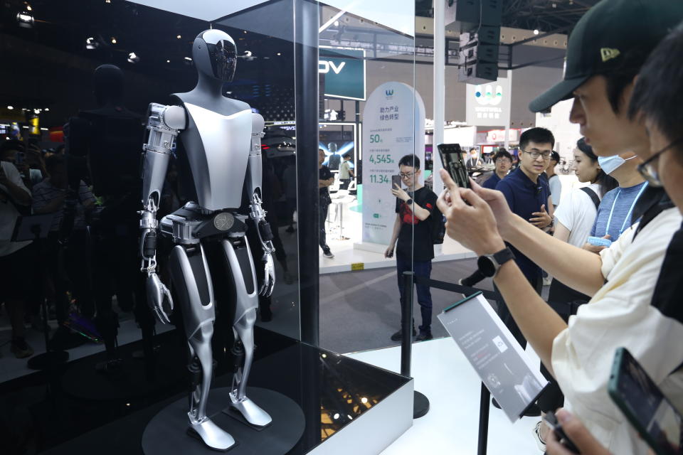 SHANGHAI, CHINA - JULY 6, 2023 - Visitors view the Tesla Bot humanoid robot of Tesla 