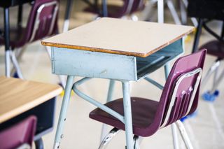 School desks in a classroom.