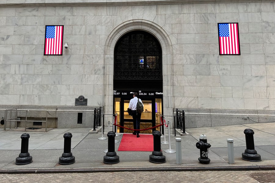 A man enters the New York Stock Exchange on Wednesday, July 17, 2024, in New York. Global stocks have mostly fallen, with shares in London declining after data showed the inflation rate remained steady at the Bank of England's 2% target in June. (AP Photo/Peter Morgan)