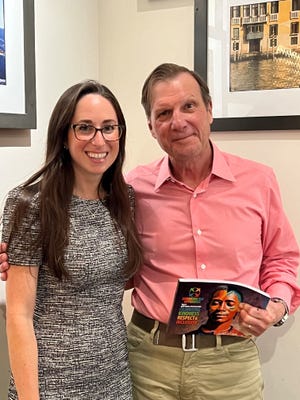 Sarah Wertheimer, left, executive director of Embracing our Differences with Hugh Culverhouse Jr., who, with his wife, Eliza, is covering the organization’s loss of $107,000 in state and county funding.