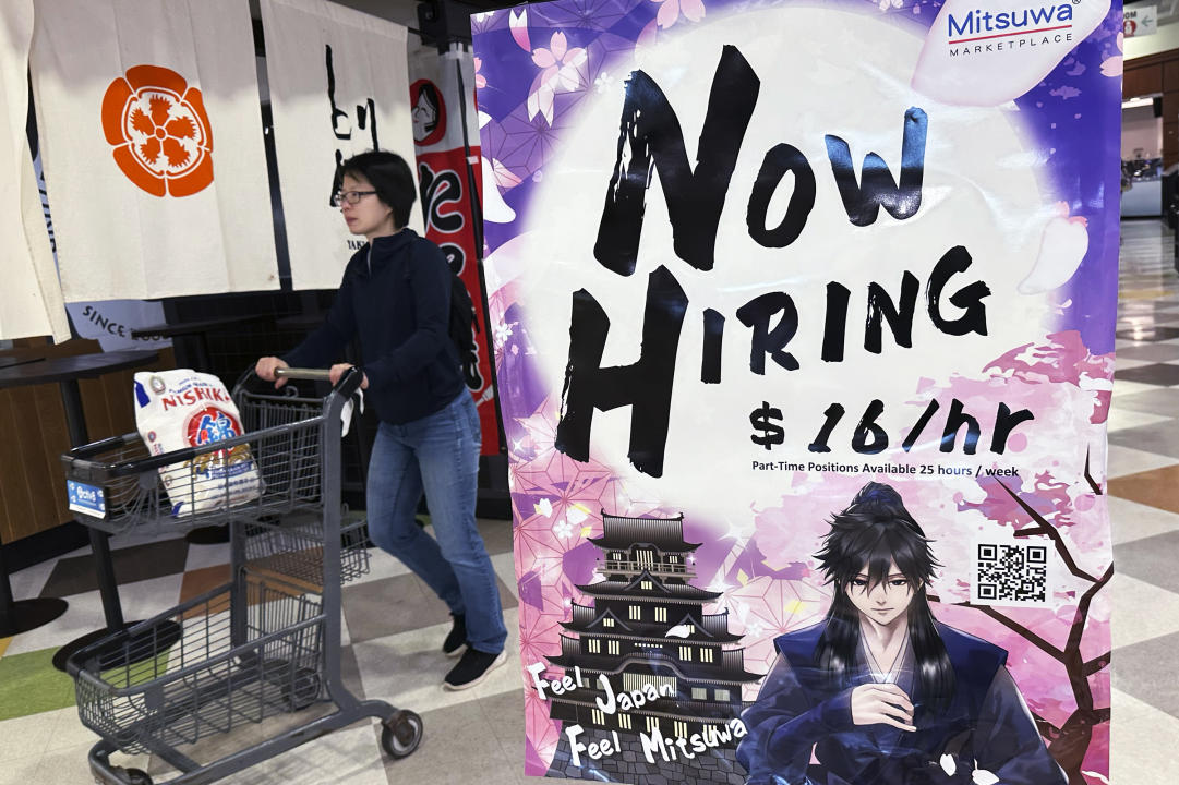 A hiring sign is displayed at a restaurant in Arlington Heights, Ill., Friday, June 28, 2024. On Tuesday, July 2, 2024, the Labor Department reports on job openings and labor turnover for May. (AP Photo/Nam Y. Huh)