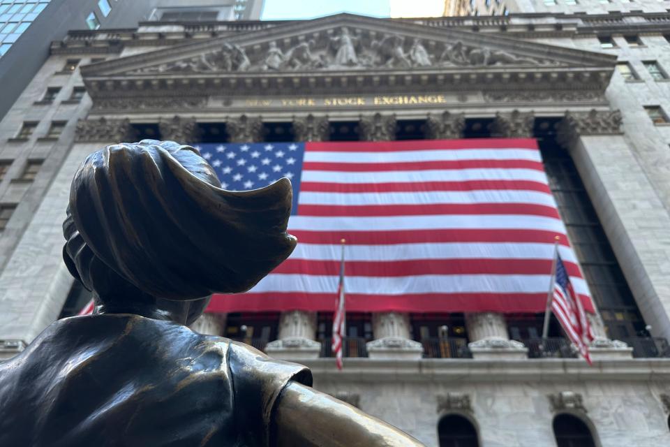 The Fearless Girl statues faces the New York Stock Exchange, Wall Street, FTSE, stocks