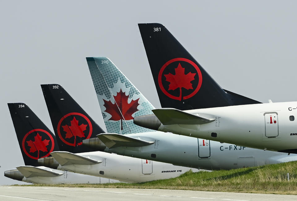 Air Canada says it is cancelling all direct flights to and from Tel Aviv through the end of the month. Air Canada planes sit on the tarmac at Pearson International Airport Toronto on Wednesday, April 28, 2021. THE CANADIAN PRESS/Nathan Denette