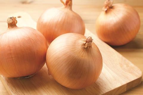 Waterman Onions pic Generic brown onions on chopping board Adobe Stock