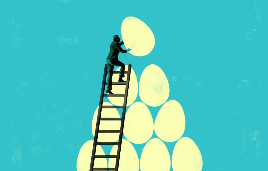 This conceptual illustration features a silhouette of a person carrying a large egg while standing at the top of a ladder, with several other oversized eggs in the background, all against a light blue textured backdrop. The image can represent themes such as ambition, nurturing new ideas, or retirement.