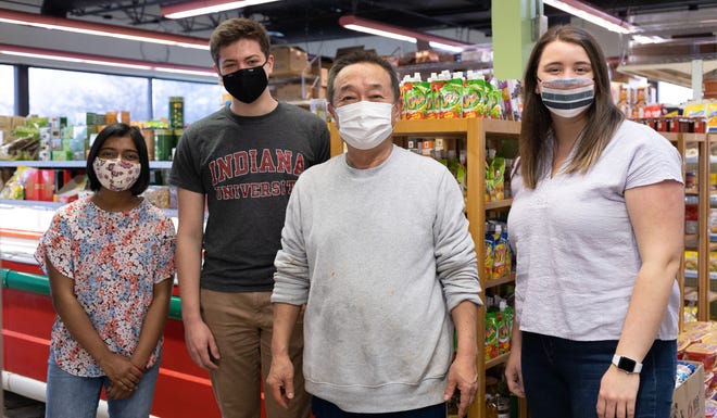 Indiana University students pick up food supplies at B-Town International Market on March 14, 2021.