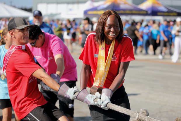 Special Olympics Southern California athletes team up to pull a...