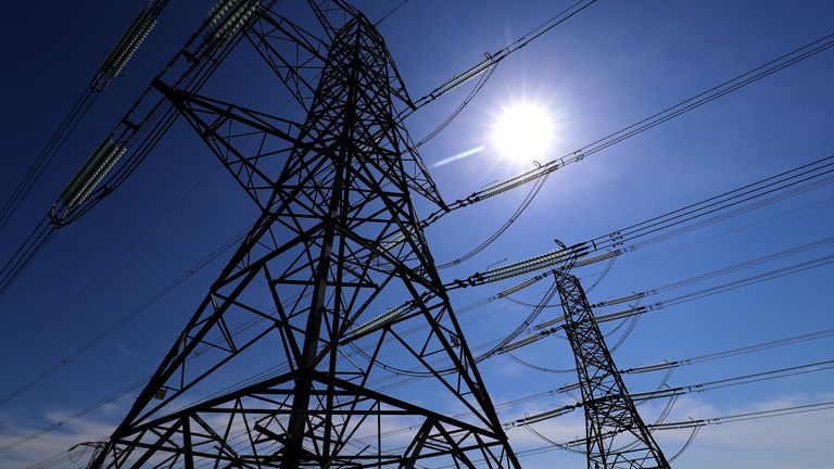 Electricity pylons carry power away from Dungeness nuclear power station in Kent as the National Grid warned that a record low demand for electricity during the UK's coronavirus lockdown could lead to windfarms and power plants being turned off to avoid overloading the electricity grid.