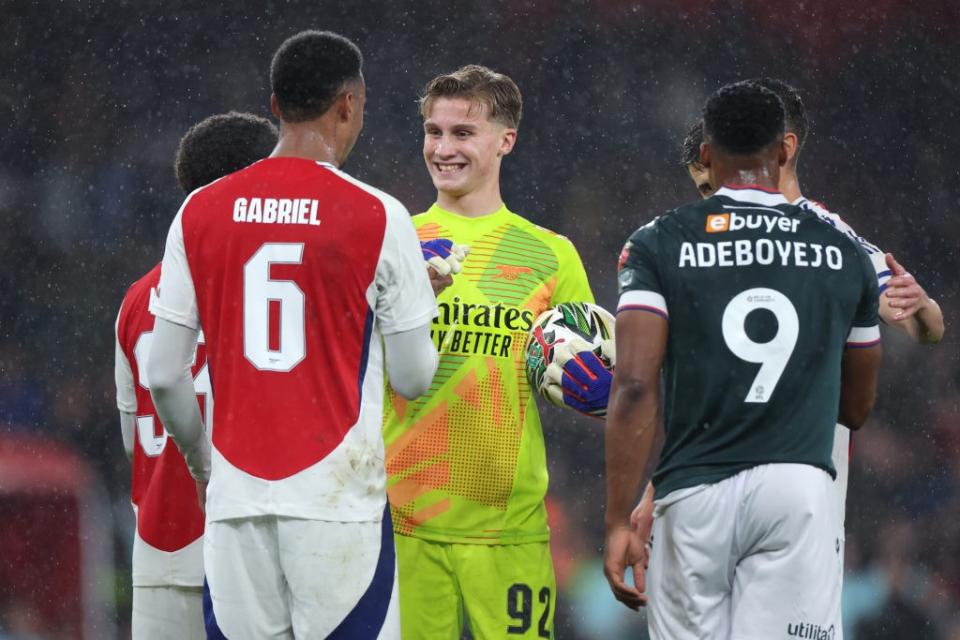 LONDON, ENGLAND - SEPTEMBER 25: Jack Porter interacts with Gabriel of Arsenal after the Carabao Cup Third Round match between Arsenal and Bolton Wanderers at Emirates Stadium on September 25, 2024 in London, England. (Photo by Alex Pantling/Getty Images)