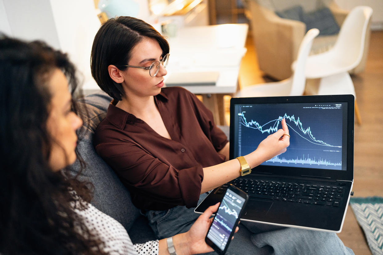 A young Caucasian woman, a financial advisor, teaching and explaining to her client new ways of investing