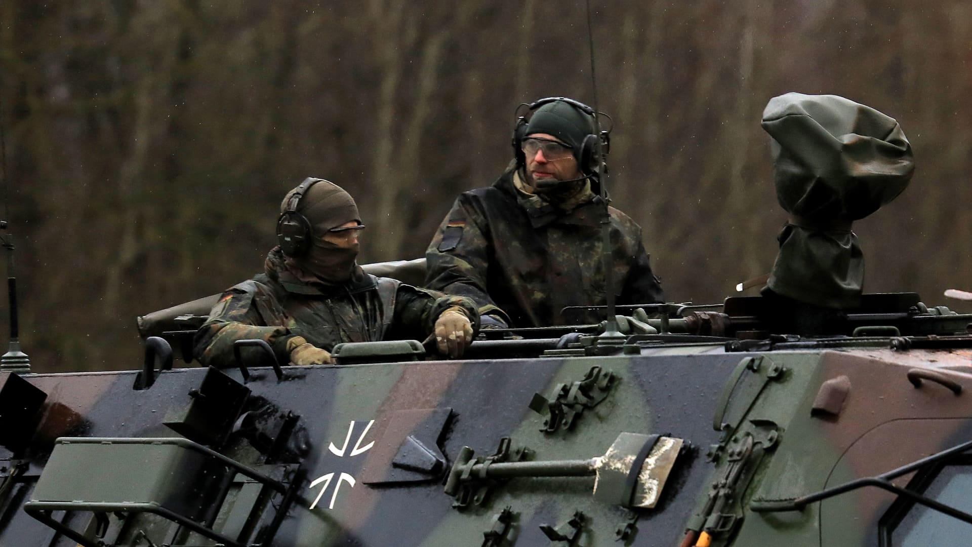 Soldiers of the German armed forces Bundeswehr arrive in an armoured vehicle at the NATO enhanced Forward Presence Battle Group Battalion in Lithuania in Rukla, Lithuania on February 17, 2022.