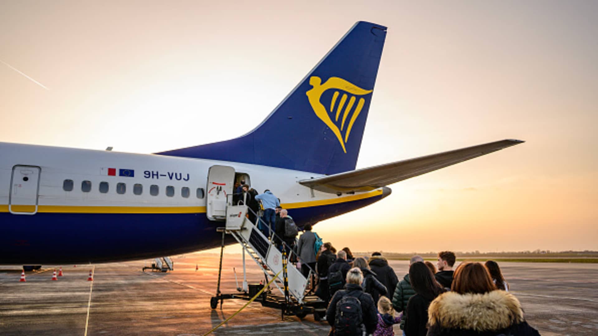 Passengers wait to board an aircraft of low cost Irish airline Ryanair at the Berlin-Brandenburg airport in Schoenefeld near Berlin, Germany, on March 13, 2024.