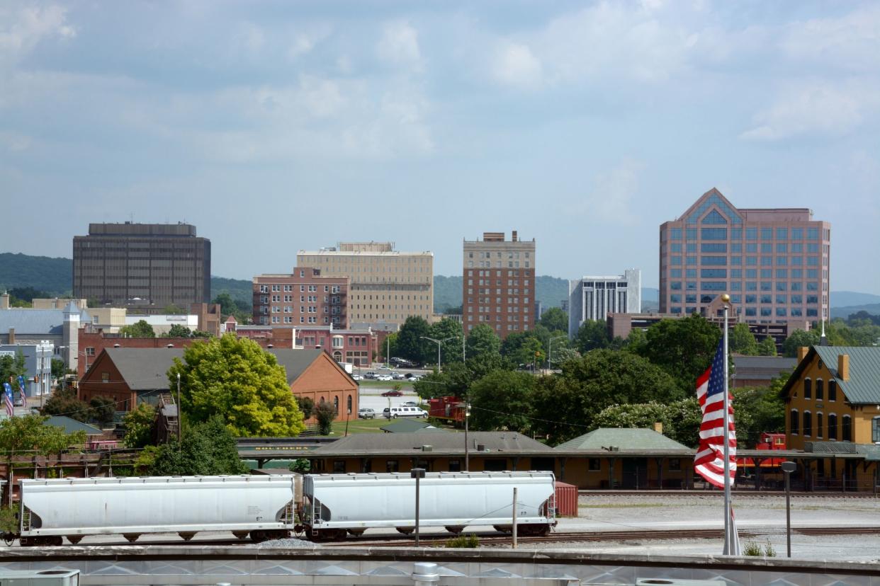 The buildings downtown sit behind the train depot.