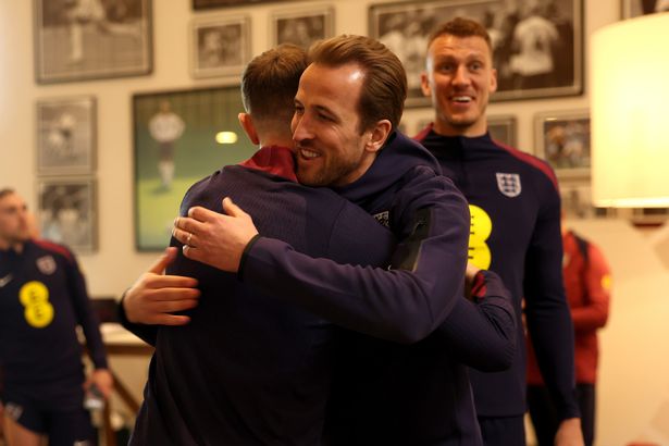 Harry Kane hugs Jordan Henderson