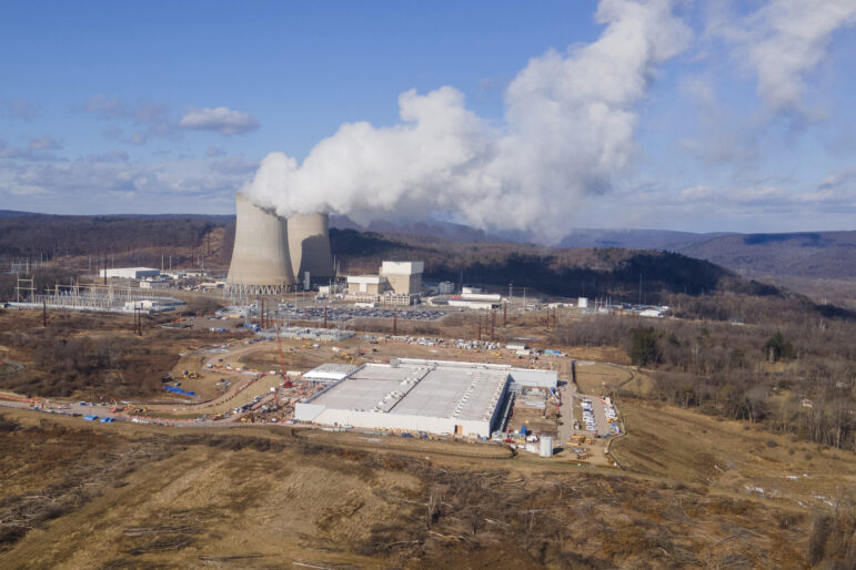 In this file photo, a data center owned by Amazon Web Services, front right, is under construction next to the Susquehanna nuclear power plant in Berwick, Pa., on Tuesday, Jan. 14, 2024.