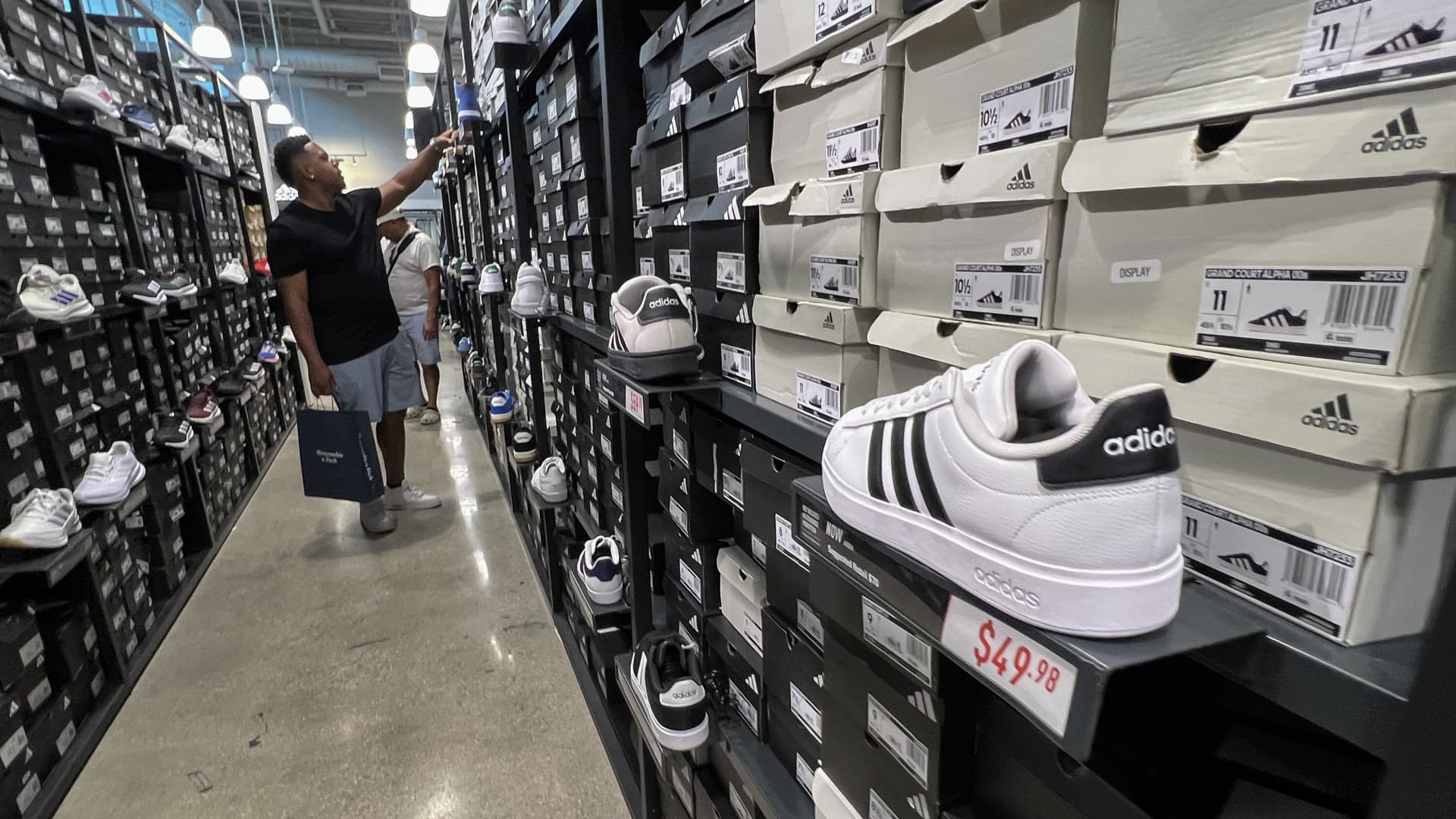 A customer shops in an Adidas store on April 4, 2025 in Miami, Florida. 