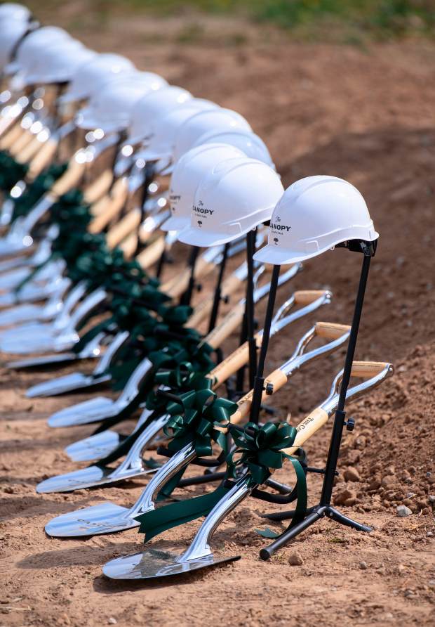 Hard hats and shovels are ready for the groundbreaking ceremony...
