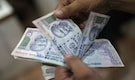 Rupee hits near 1-1/2 year high; bonds rally, shares fall