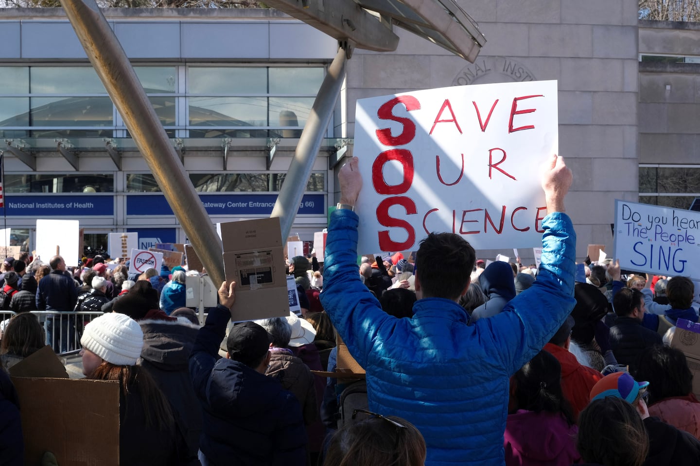 Demonstrators protested funding cuts outside the National Institutes of Health in Bethesda, Md., on March 8.