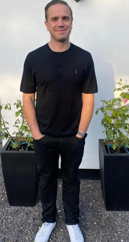 Man standing outside wearing a black shirt and black pants.