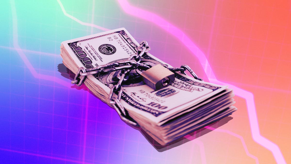 A wad of cash with a padlock wrapped around it
