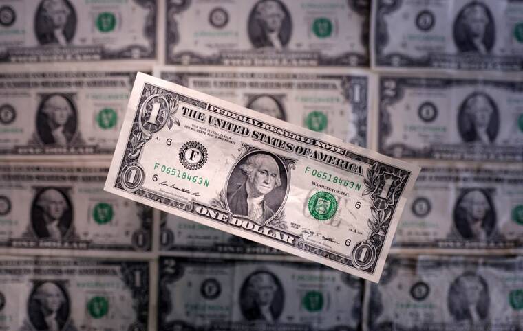 REUTERS/DADO RUVIC/ILLUSTRATION
                                Dollar banknotes are seen in this illustration on March 19. The dollar staged a broad retreat today, as investor gloom over the lack of progress toward defusing the U.S.-China trade war reasserted itself following an interlude of optimism the previous day.