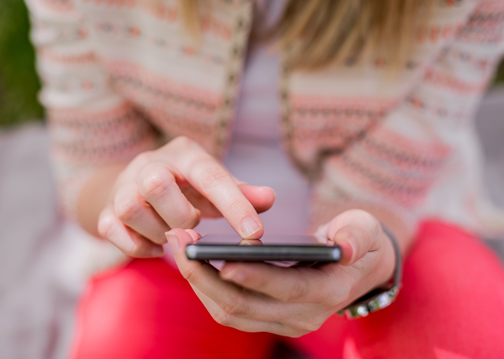 Close up woman’s hand holding phone.