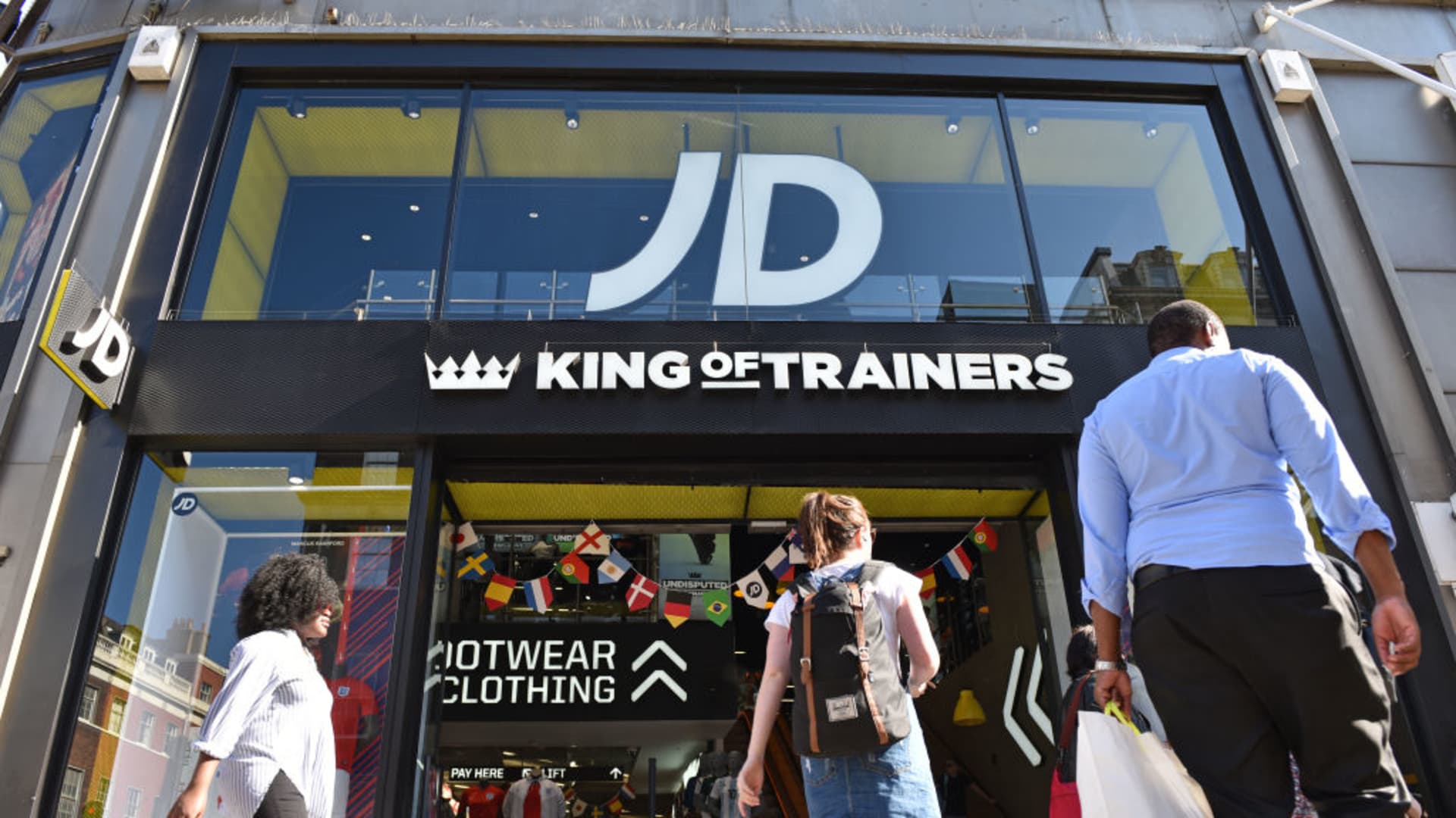 LONDON, ENGLAND - JUNE 11: Shoppers walk past JD Sports King of Trainers retail shop on Oxford Street on June 11, 2018 in London, England. (photo by John Keeble/Getty Images)