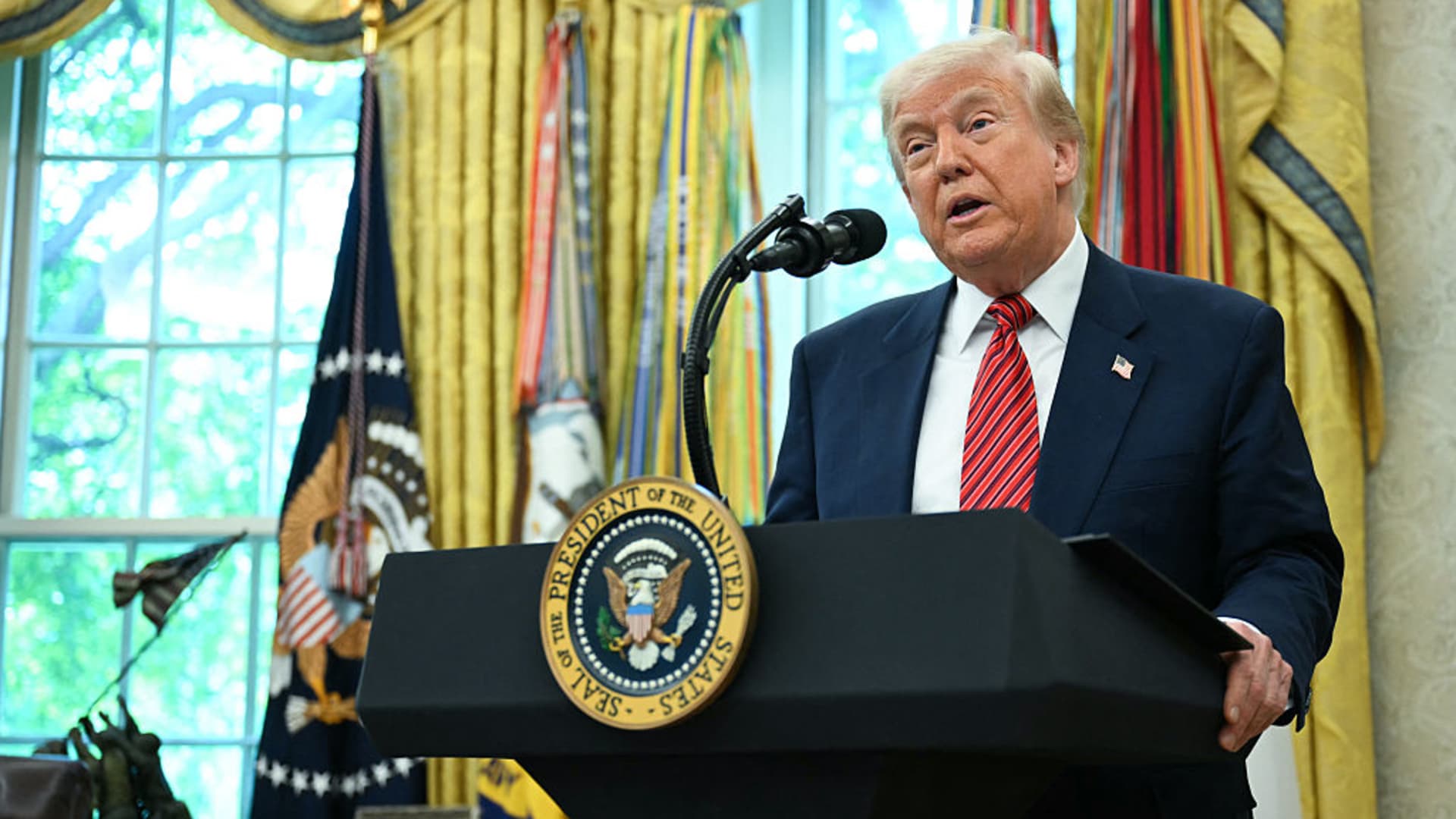 US President Donald Trump speaks during a swearing-in ceremony for the Ambassador to China, former Republican Senator of Georgia, David Perdue, in the Oval Office of the White House in Washington, DC, May 7, 2025. 