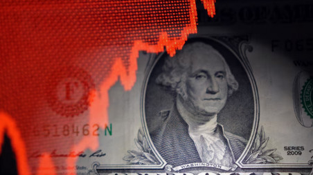 US dollar banknote and rising stock graph are seen in this illustration taken April 25, 2025. REUTERS/Dado Ruvic/Illustration/File Photo