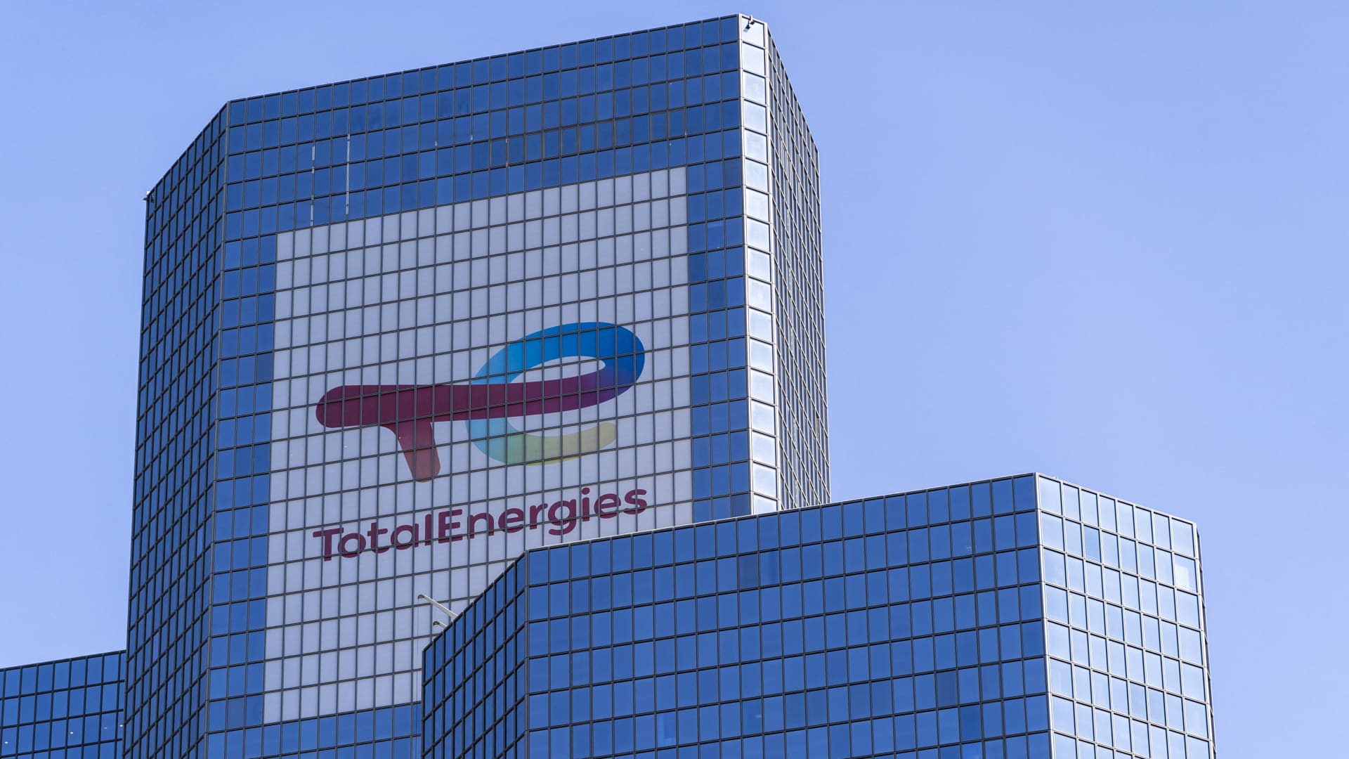 Poster and logo on the Coupole Tower, compagny Total's head office renamed TotalEnergies in 2021 in the La Defense business district west of Paris in Courbevoie, France on 7 June 2024.