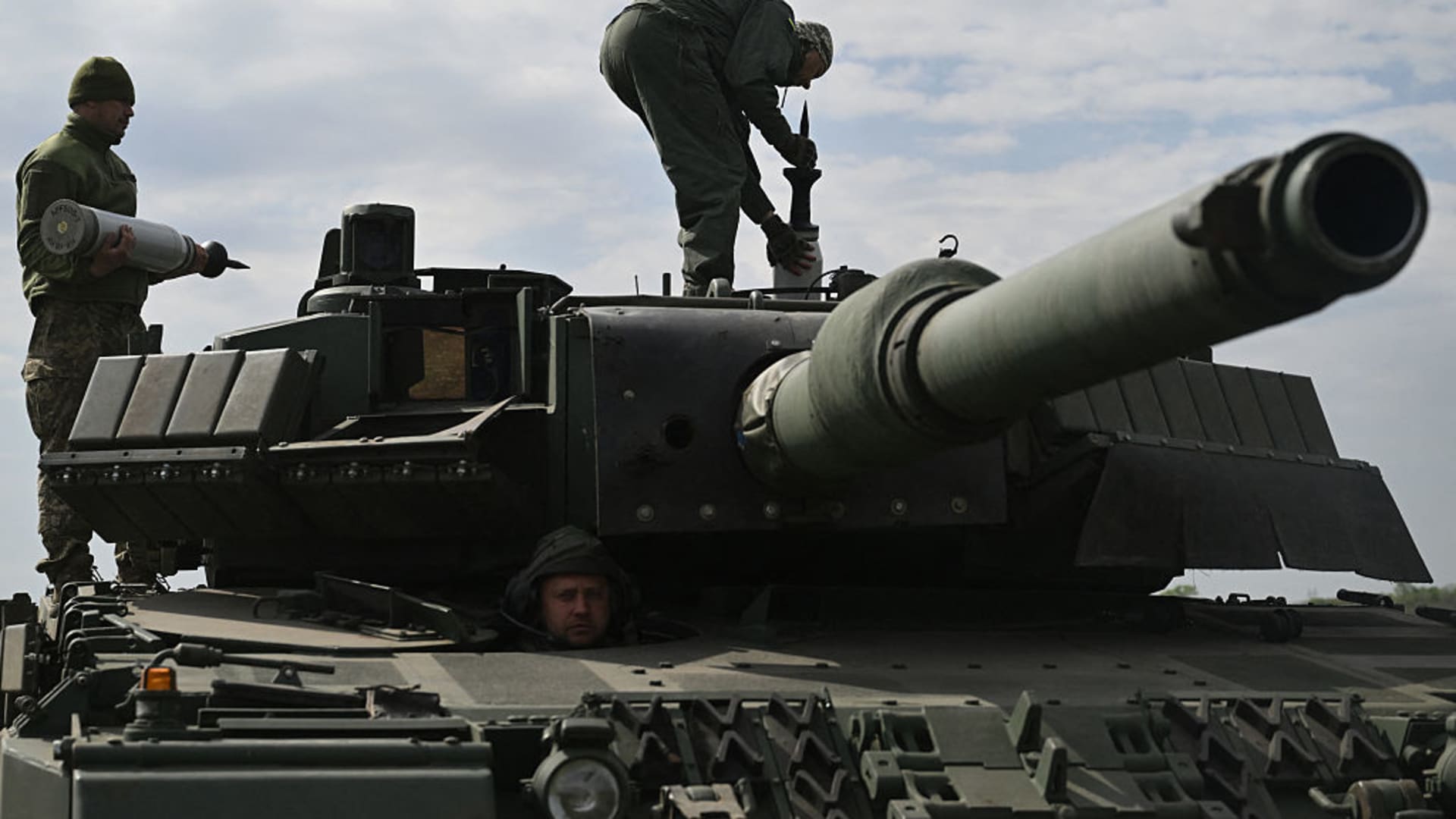 A Ukrainian tank crew of the 33rd Separate Mechanized Brigade load tank ammunition onto a Leopard 2A4 tank during a field training exercise at an undisclosed location in Ukraine, on April 30, 2025.