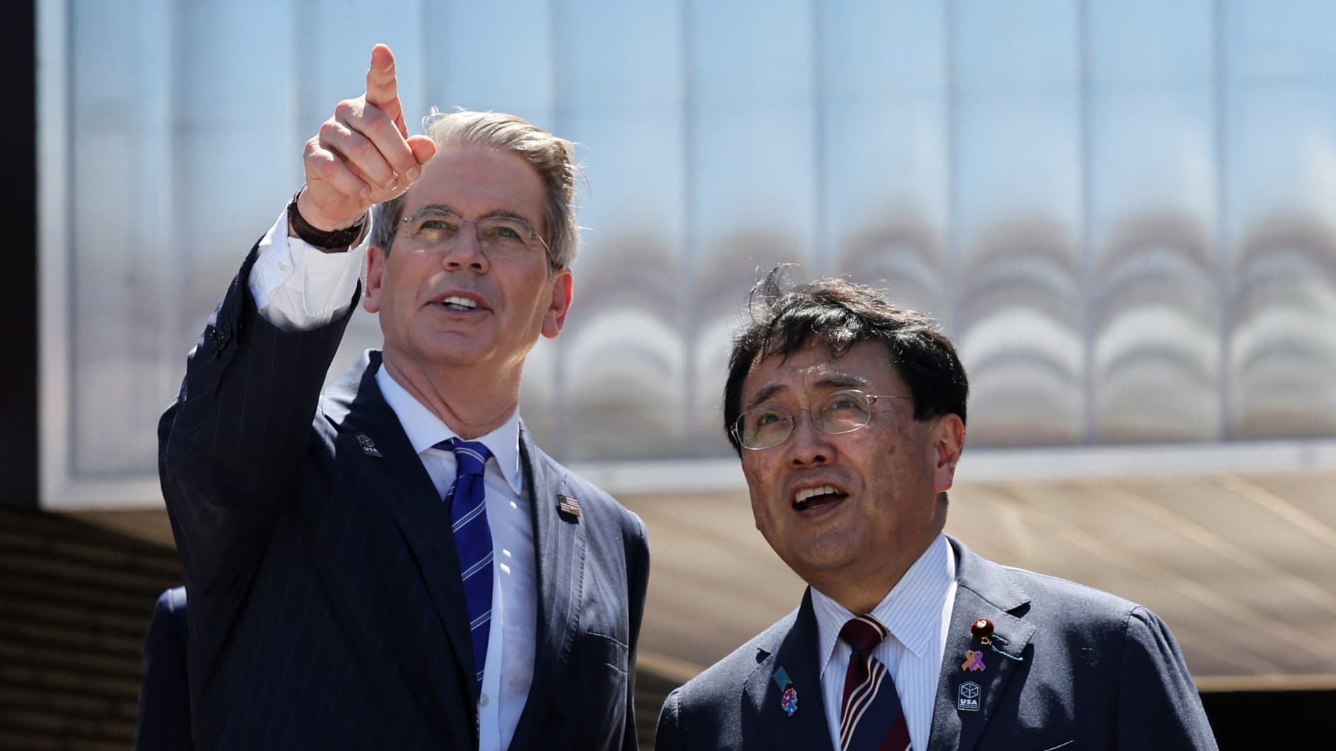 U.S. Secretary of the Treasury Scott Bessent gestures as Japan's Economic Revitalization Minister Ryosei Akazawa looks on the day they visit U.S. pavilion at Expo 2025 in Osaka, Japan, July 19, 2025. 