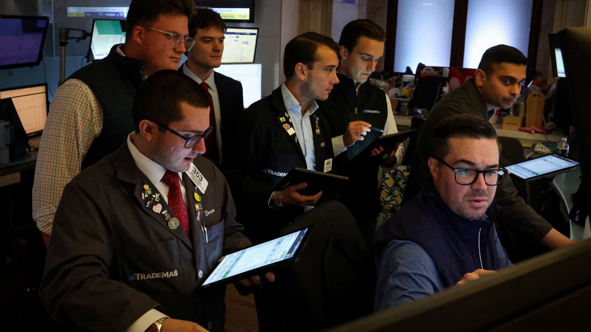 Traders work on the floor at the New York Stock Exchange in New York City, U.S., July 21, 2025.